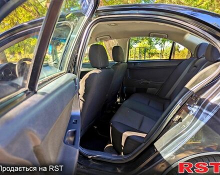 Черный Мицубиси Лансер, объемом двигателя 1.5 л и пробегом 235 тыс. км за 5250 $, фото 6 на Automoto.ua