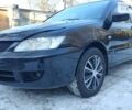 Черный Мицубиси Лансер, объемом двигателя 1.6 л и пробегом 166 тыс. км за 5500 $, фото 26 на Automoto.ua