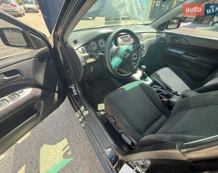 Чорний Міцубісі Lancer, об'ємом двигуна 1.6 л та пробігом 292 тис. км за 3600 $, фото 20 на Automoto.ua