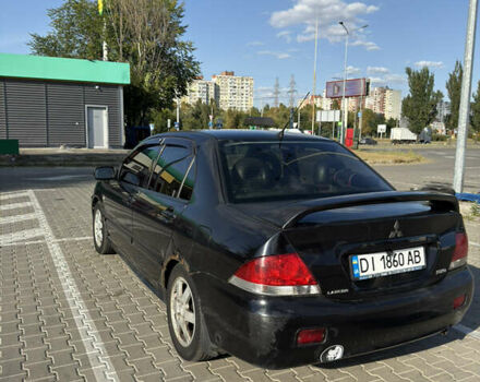 Черный Мицубиси Лансер, объемом двигателя 1.58 л и пробегом 364 тыс. км за 3000 $, фото 5 на Automoto.ua