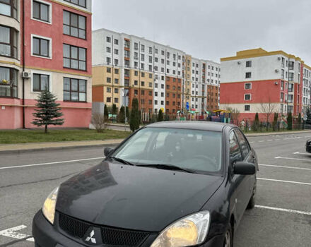 Чорний Міцубісі Lancer, об'ємом двигуна 1.58 л та пробігом 388 тис. км за 2300 $, фото 1 на Automoto.ua