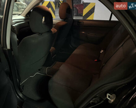 Чорний Міцубісі Lancer, об'ємом двигуна 1.58 л та пробігом 212 тис. км за 5500 $, фото 10 на Automoto.ua