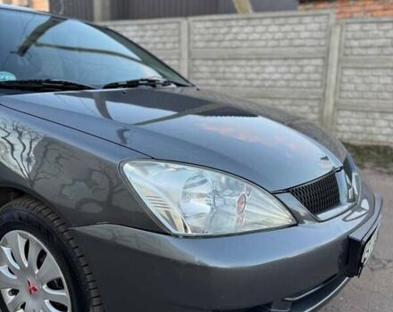 Черный Мицубиси Лансер, объемом двигателя 1.6 л и пробегом 225 тыс. км за 3400 $, фото 5 на Automoto.ua