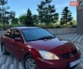 Черный Мицубиси Лансер, объемом двигателя 1.6 л и пробегом 256 тыс. км за 4800 $, фото 1 на Automoto.ua