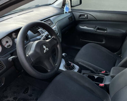 Черный Мицубиси Лансер, объемом двигателя 1.59 л и пробегом 348 тыс. км за 4200 $, фото 6 на Automoto.ua