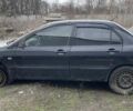 Чорний Міцубісі Lancer, об'ємом двигуна 1.6 л та пробігом 216 тис. км за 1800 $, фото 1 на Automoto.ua