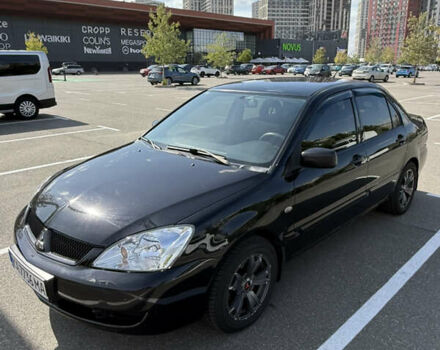 Черный Мицубиси Лансер, объемом двигателя 1.6 л и пробегом 321 тыс. км за 5000 $, фото 4 на Automoto.ua