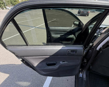 Черный Мицубиси Лансер, объемом двигателя 1.6 л и пробегом 321 тыс. км за 5000 $, фото 31 на Automoto.ua