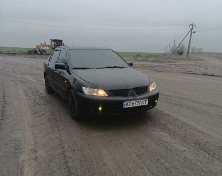 Чорний Міцубісі Lancer, об'ємом двигуна 1.58 л та пробігом 233 тис. км за 4800 $, фото 1 на Automoto.ua