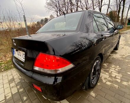 Черный Мицубиси Лансер, объемом двигателя 1.6 л и пробегом 240 тыс. км за 4200 $, фото 1 на Automoto.ua