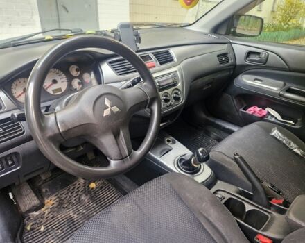 Черный Мицубиси Лансер, объемом двигателя 1.6 л и пробегом 243 тыс. км за 2900 $, фото 2 на Automoto.ua