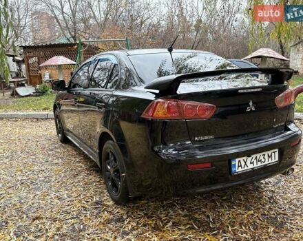 Черный Мицубиси Лансер, объемом двигателя 2 л и пробегом 260 тыс. км за 6100 $, фото 7 на Automoto.ua
