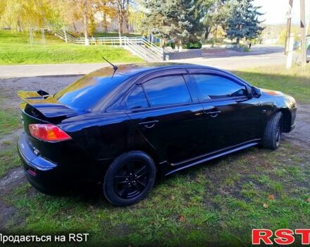 Черный Мицубиси Лансер, объемом двигателя 2 л и пробегом 196 тыс. км за 5500 $, фото 2 на Automoto.ua