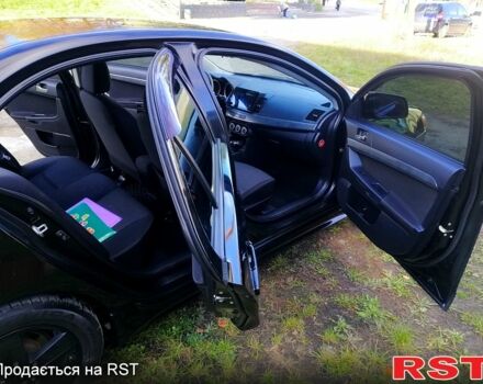 Черный Мицубиси Лансер, объемом двигателя 2 л и пробегом 196 тыс. км за 5500 $, фото 6 на Automoto.ua