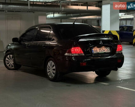 Чорний Міцубісі Lancer, об'ємом двигуна 1.58 л та пробігом 212 тис. км за 5500 $, фото 4 на Automoto.ua
