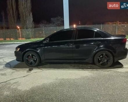 Черный Мицубиси Лансер, объемом двигателя 2 л и пробегом 240 тыс. км за 6400 $, фото 7 на Automoto.ua