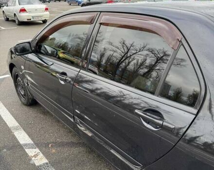 Чорний Міцубісі Lancer, об'ємом двигуна 1.6 л та пробігом 245 тис. км за 4500 $, фото 11 на Automoto.ua