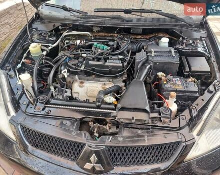 Чорний Міцубісі Lancer, об'ємом двигуна 1.6 л та пробігом 215 тис. км за 4900 $, фото 8 на Automoto.ua