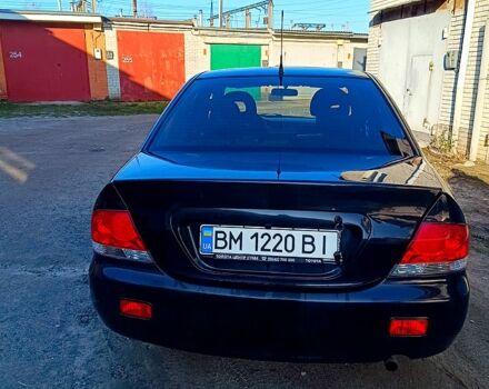 Черный Мицубиси Лансер, объемом двигателя 1.6 л и пробегом 230 тыс. км за 4700 $, фото 1 на Automoto.ua