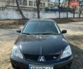 Черный Мицубиси Лансер, объемом двигателя 1.58 л и пробегом 178 тыс. км за 5000 $, фото 1 на Automoto.ua