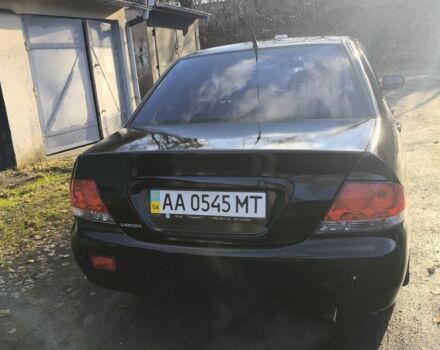 Черный Мицубиси Лансер, объемом двигателя 1.6 л и пробегом 243 тыс. км за 3200 $, фото 4 на Automoto.ua