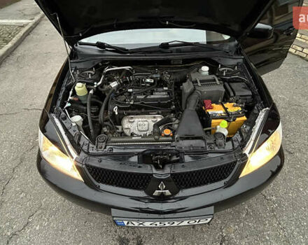 Чорний Міцубісі Lancer, об'ємом двигуна 1.58 л та пробігом 167 тис. км за 4800 $, фото 15 на Automoto.ua