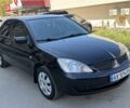 Черный Мицубиси Лансер, объемом двигателя 1.6 л и пробегом 207 тыс. км за 5500 $, фото 1 на Automoto.ua