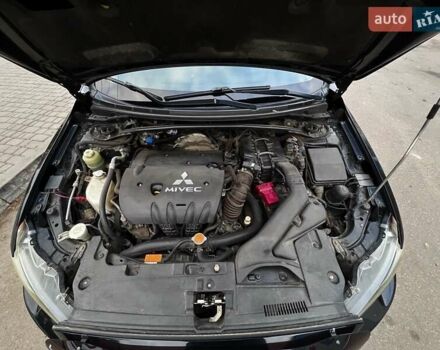 Черный Мицубиси Лансер, объемом двигателя 2 л и пробегом 222 тыс. км за 6000 $, фото 3 на Automoto.ua