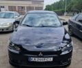 Черный Мицубиси Лансер, объемом двигателя 2 л и пробегом 178 тыс. км за 6700 $, фото 1 на Automoto.ua