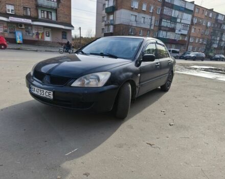 Черный Мицубиси Лансер, объемом двигателя 1.6 л и пробегом 358 тыс. км за 4300 $, фото 1 на Automoto.ua