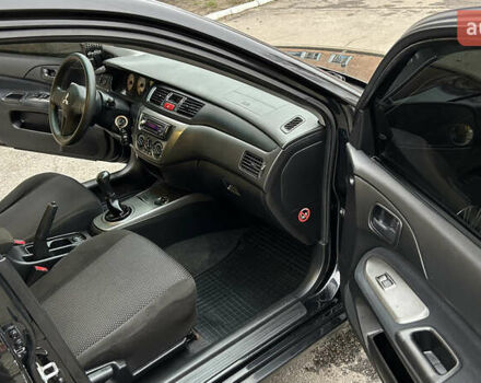 Чорний Міцубісі Lancer, об'ємом двигуна 1.58 л та пробігом 167 тис. км за 4800 $, фото 10 на Automoto.ua