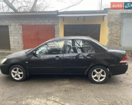 Черный Мицубиси Лансер, объемом двигателя 1.6 л и пробегом 143 тыс. км за 3000 $, фото 3 на Automoto.ua