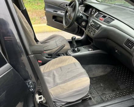 Чорний Міцубісі Lancer, об'ємом двигуна 1.58 л та пробігом 192 тис. км за 4500 $, фото 8 на Automoto.ua