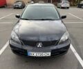 Чорний Міцубісі Lancer, об'ємом двигуна 1.6 л та пробігом 245 тис. км за 4500 $, фото 1 на Automoto.ua