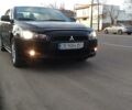 Чорний Міцубісі Lancer, об'ємом двигуна 2 л та пробігом 215 тис. км за 8799 $, фото 1 на Automoto.ua