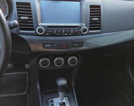 Черный Мицубиси Лансер, объемом двигателя 2 л и пробегом 245 тыс. км за 5600 $, фото 9 на Automoto.ua