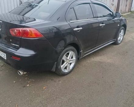 Черный Мицубиси Лансер, объемом двигателя 2 л и пробегом 192 тыс. км за 6350 $, фото 10 на Automoto.ua