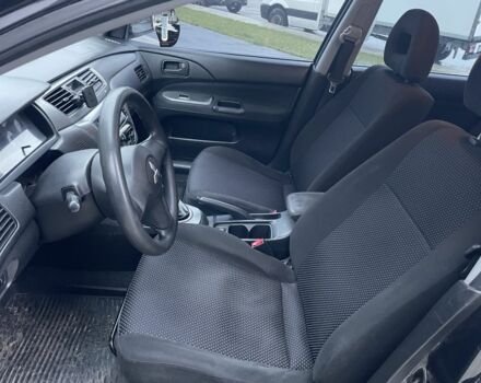 Черный Мицубиси Лансер, объемом двигателя 1.6 л и пробегом 226 тыс. км за 3750 $, фото 9 на Automoto.ua