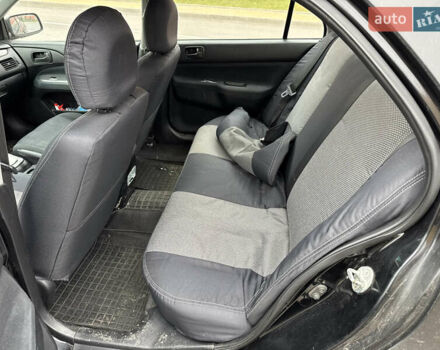 Чорний Міцубісі Lancer, об'ємом двигуна 1.58 л та пробігом 388 тис. км за 2300 $, фото 12 на Automoto.ua