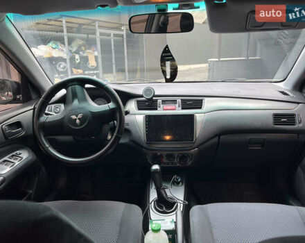 Черный Мицубиси Лансер, объемом двигателя 1.6 л и пробегом 167 тыс. км за 4850 $, фото 2 на Automoto.ua