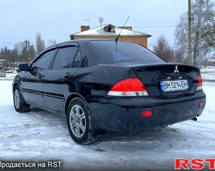 Чорний Міцубісі Lancer, об'ємом двигуна 1.6 л та пробігом 245 тис. км за 5600 $, фото 6 на Automoto.ua