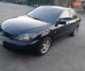 Чорний Міцубісі Lancer, об'ємом двигуна 1.58 л та пробігом 286 тис. км за 4950 $, фото 6 на Automoto.ua