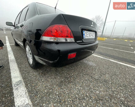 Черный Мицубиси Лансер, объемом двигателя 1.58 л и пробегом 214 тыс. км за 4400 $, фото 7 на Automoto.ua