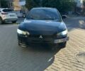 Черный Мицубиси Лансер, объемом двигателя 2 л и пробегом 230 тыс. км за 5500 $, фото 1 на Automoto.ua