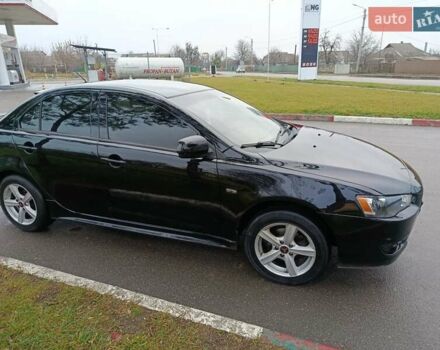 Черный Мицубиси Лансер, объемом двигателя 2 л и пробегом 200 тыс. км за 5100 $, фото 16 на Automoto.ua