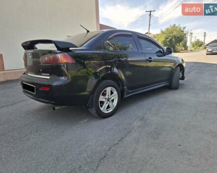 Черный Мицубиси Лансер, объемом двигателя 2 л и пробегом 230 тыс. км за 7000 $, фото 16 на Automoto.ua