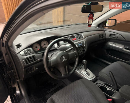 Чорний Міцубісі Lancer, об'ємом двигуна 1.6 л та пробігом 265 тис. км за 4700 $, фото 17 на Automoto.ua