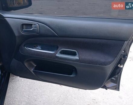 Чорний Міцубісі Lancer, об'ємом двигуна 1.58 л та пробігом 286 тис. км за 4950 $, фото 14 на Automoto.ua