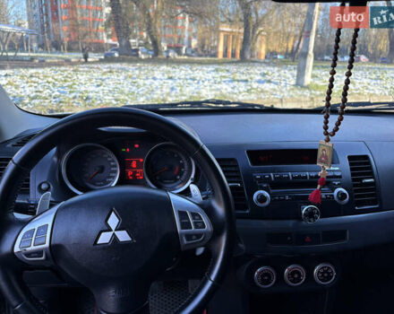 Черный Мицубиси Лансер, объемом двигателя 2 л и пробегом 236 тыс. км за 6450 $, фото 10 на Automoto.ua