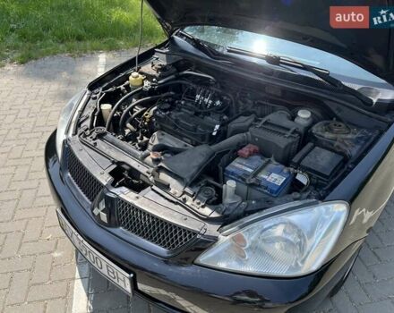 Чорний Міцубісі Lancer, об'ємом двигуна 1.6 л та пробігом 296 тис. км за 4200 $, фото 11 на Automoto.ua